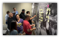 SSR mining working on an activity on the wall during Lean Six Sigma training